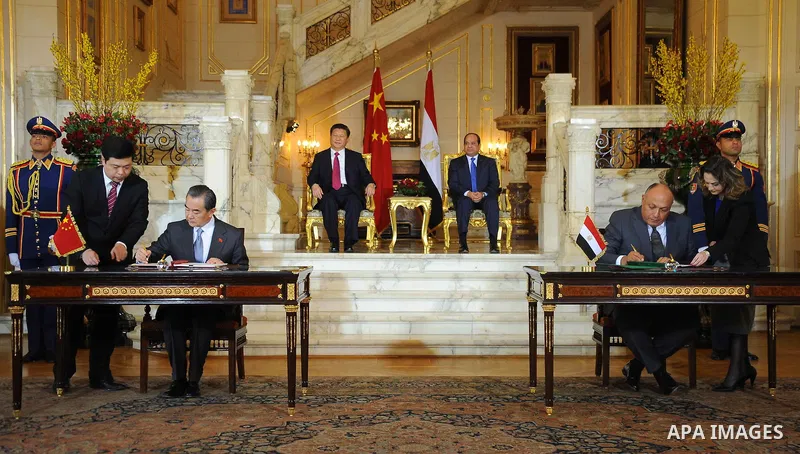 Egypt's President Abdel Fattah al-Sisi and China's President Xi Jinping attend the signature of trade deals in the Egyptian capital Cairo on Jan. 21, 2016. Jinping signed a slew of trade deals with Egypt's leader as part...