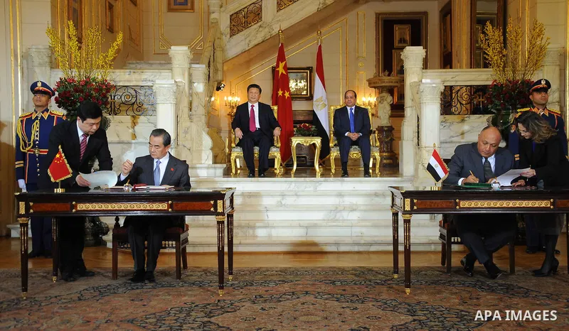 Egypt's President Abdel Fattah al-Sisi and China's President Xi Jinping attend the signature of trade deals in the Egyptian capital Cairo on Jan. 21, 2016. Jinping signed a slew of trade deals with Egypt's leader as part...
