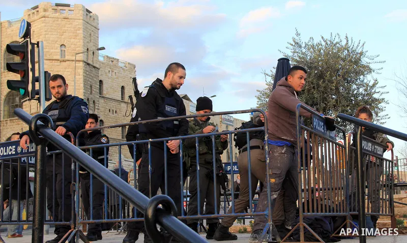Israeli police inspect a Palestinian youth in front of Damascus gate, in Jerusalem's old city on Jan. 21, 2016. Two Palestinian minors were detained from Jerusalem district. One was identified as Muhammad Yaghmur, 14. To...