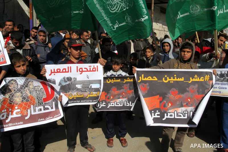 Palestinians supporting Hamas take part in a rally calling for an end to the blockade on Gaza, near the border with Egypt, in Rafah in the southern Gaza Strip, January 22, 2016. Gaza, a small impoverished coastal enclave...