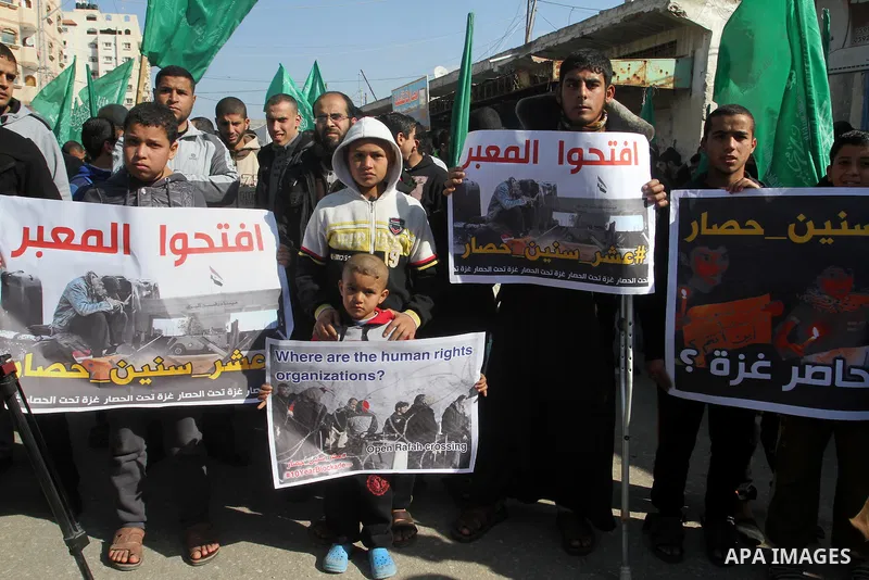Palestinians supporting Hamas take part in a rally calling for an end to the blockade on Gaza, near the border with Egypt, in Rafah in the southern Gaza Strip, January 22, 2016. Gaza, a small impoverished coastal enclave...