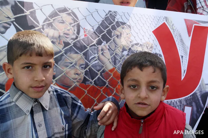 Palestinians supporting Hamas take part in a rally calling for an end to the blockade on Gaza, near the border with Egypt, in Rafah in the southern Gaza Strip, January 22, 2016. Gaza, a small impoverished coastal enclave...