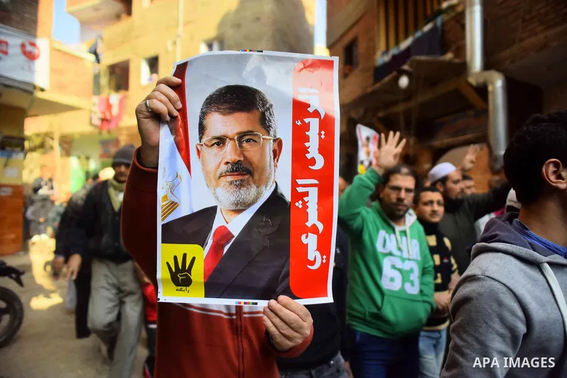 Egyptian supporters of Muslim Brotherhood and deposed President Mohamed Morsi, shot slogans during a demonstration against the President Abdel Fattah al-Sisi in Faisal district of Giza, Egypt, Jan. 22, 2016. Photo by Amr...