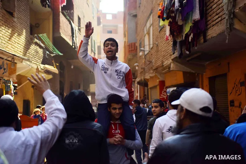 Egyptian supporters of Muslim Brotherhood and deposed President Mohamed Morsi, shot slogans during a demonstration against the President Abdel Fattah al-Sisi in Faisal district of Giza, Egypt, Jan. 22, 2016. Photo by Amr...