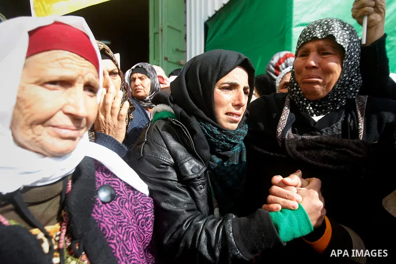 Palestinians mourn of Ruqya Abu Eid, 13, during her funeral, who Israeli military said was shot dead by Israeli soldiers after he tried to stab a soldier, in the West Bank city of Hebron, on January, 24, 2016. Photo by W...