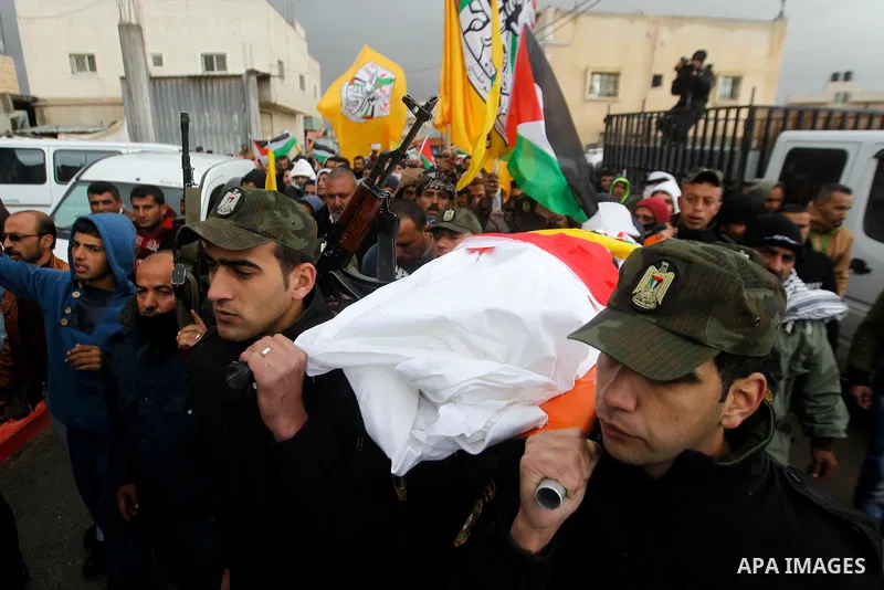 Palestinians carry the body of Ruqya Abu Eid, 13, during her funeral, who Israeli military said was shot dead by Israeli soldiers after he tried to stab a soldier, in the West Bank city of Hebron, on January, 24, 2016. P...