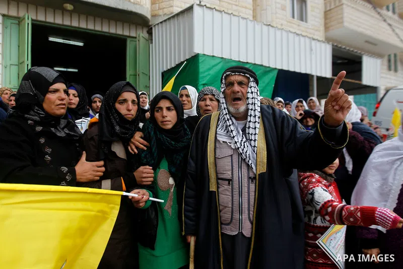 Palestinians carry the body of Ruqya Abu Eid, 13, during her funeral, who Israeli military said was shot dead by Israeli soldiers after he tried to stab a soldier, in the West Bank city of Hebron, on January, 24, 2016. P...