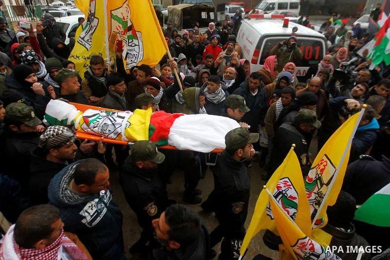 Palestinians carry the body of Ruqya Abu Eid, 13, during her funeral, who Israeli military said was shot dead by Israeli soldiers after he tried to stab a soldier, in the West Bank city of Hebron, on January, 24, 2016. P...
