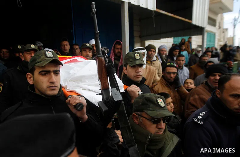 Palestinians carry the body of Ruqya Abu Eid, 13, during her funeral, who Israeli military said was shot dead by Israeli soldiers after he tried to stab a soldier, in the West Bank city of Hebron, on January, 24, 2016. P...