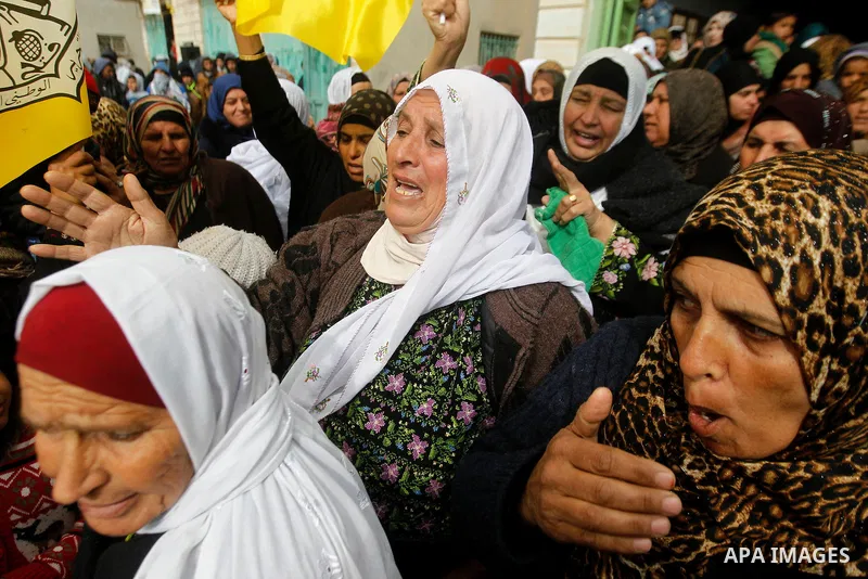 Palestinians mourn of Ruqya Abu Eid, 13, during her funeral, who Israeli military said was shot dead by Israeli soldiers after he tried to stab a soldier, in the West Bank city of Hebron, on January, 24, 2016. Photo by W...