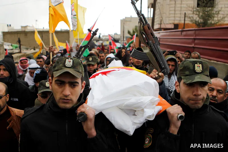 Palestinians carry the body of Ruqya Abu Eid, 13, during her funeral, who Israeli military said was shot dead by Israeli soldiers after he tried to stab a soldier, in the West Bank city of Hebron, on January, 24, 2016. P...