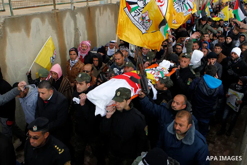 Palestinians carry the body of Ruqya Abu Eid, 13, during her funeral, who Israeli military said was shot dead by Israeli soldiers after he tried to stab a soldier, in the West Bank city of Hebron, on January, 24, 2016. P...