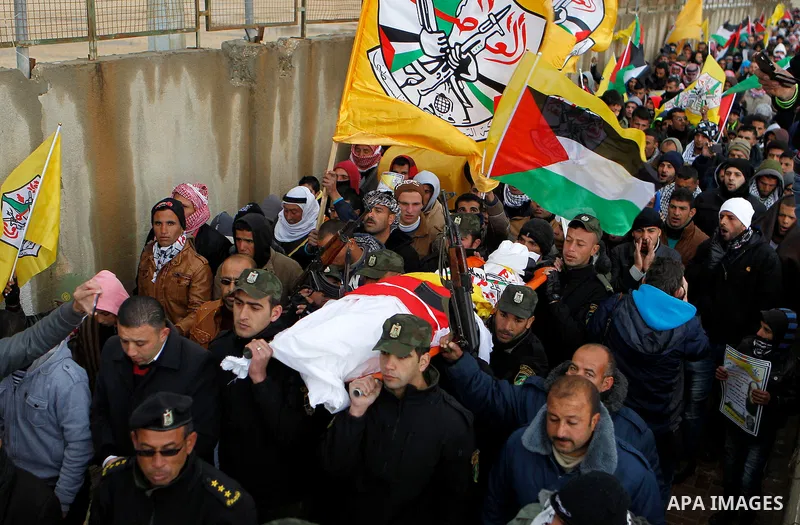 Palestinians carry the body of Ruqya Abu Eid, 13, during her funeral, who Israeli military said was shot dead by Israeli soldiers after he tried to stab a soldier, in the West Bank city of Hebron, on January, 24, 2016. P...