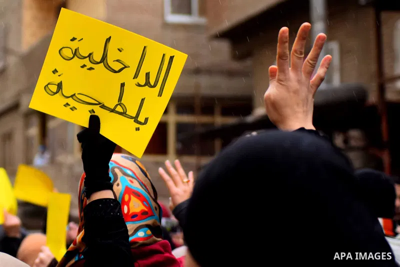 Egyptian supporters of ousted Islamist president Mohamed Morsi march shouting slogans in al-Haram neighbourhood in the southern Cairo Giza district on January 25, 2016 but dispersed within minutes for fear of retaliation...