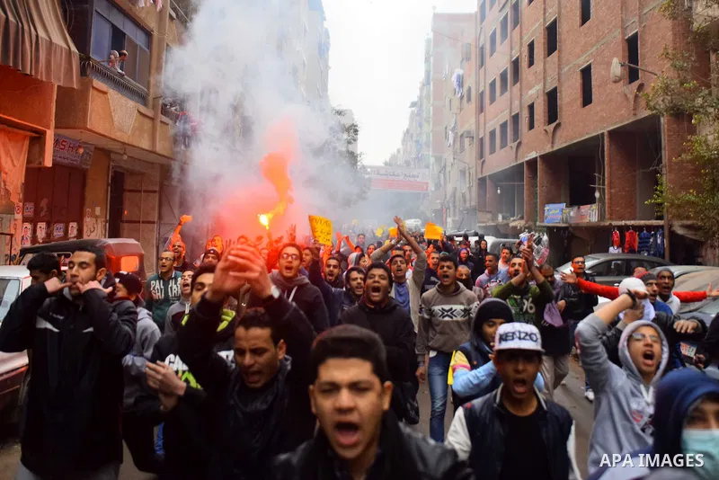 Egyptian supporters of ousted Islamist president Mohamed Morsi march shouting slogans in al-Haram neighbourhood in the southern Cairo Giza district on January 25, 2016 but dispersed within minutes for fear of retaliation...