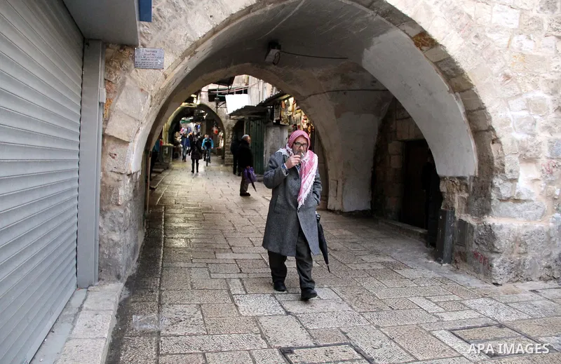 A Palestinian man walks at street in Jerusalem's Old city on Jan. 26, 2016. Photo by Mahfouz Abu Turk
