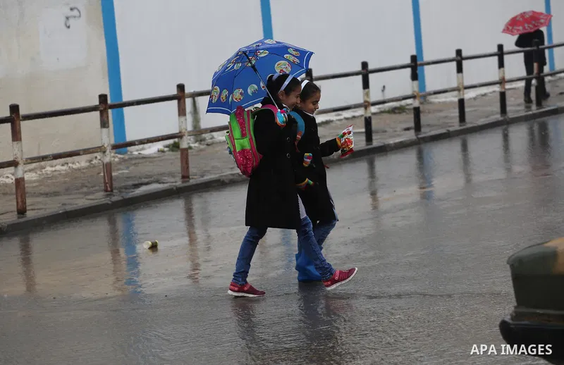 Palestinian students walk with their umbrella under the rain, during a winter storm in Gaza city, on january 27, 2016. Photo by Mohammed Asad