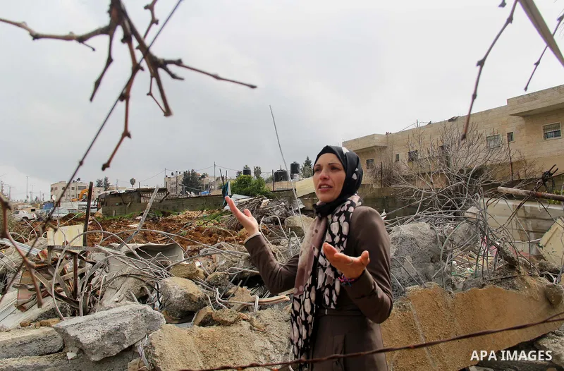 Palestinians look at the rubble of their house that was demolished by Israeli bulldozerst, in the Arab east Jerusalem neighbourhood of Shuafat on January 27, 2016. Palestinian homes built without an Israeli construction...