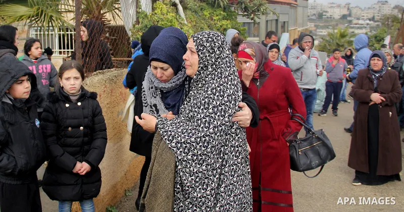 Palestinians look at the rubble of their house that was demolished by Israeli bulldozerst, in the Arab east Jerusalem neighbourhood of Shuafat on January 27, 2016. Palestinian homes built without an Israeli construction...