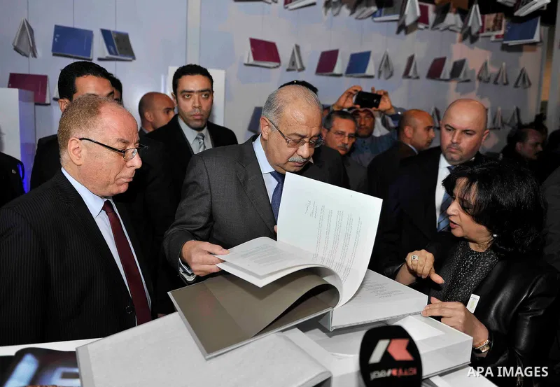 Egyptian Prime Minister Sherif Ismail opens the Cairo International Book Fair, in Cairo, Egypt, on Jan. 27, 2016. Photo by Stranger