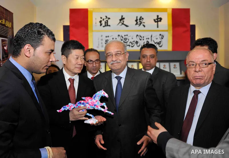 Egyptian Prime Minister Sherif Ismail opens the Cairo International Book Fair, in Cairo, Egypt, on Jan. 27, 2016. Photo by Stranger