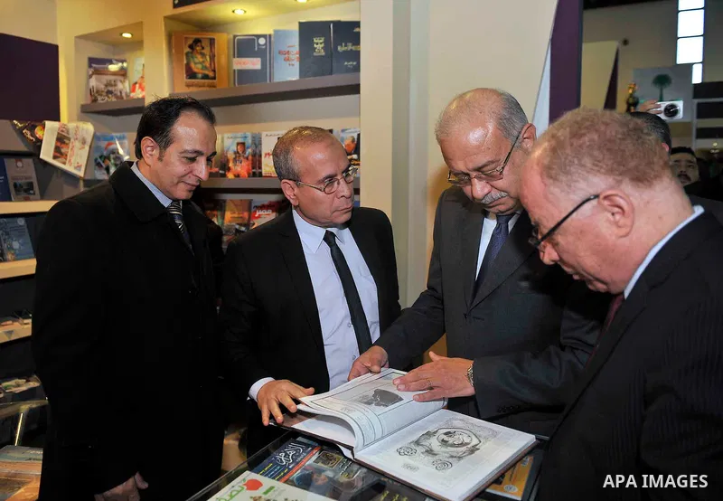 Egyptian Prime Minister Sherif Ismail opens the Cairo International Book Fair, in Cairo, Egypt, on Jan. 27, 2016. Photo by Stranger