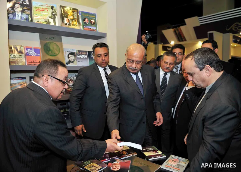Egyptian Prime Minister Sherif Ismail opens the Cairo International Book Fair, in Cairo, Egypt, on Jan. 27, 2016. Photo by Stranger