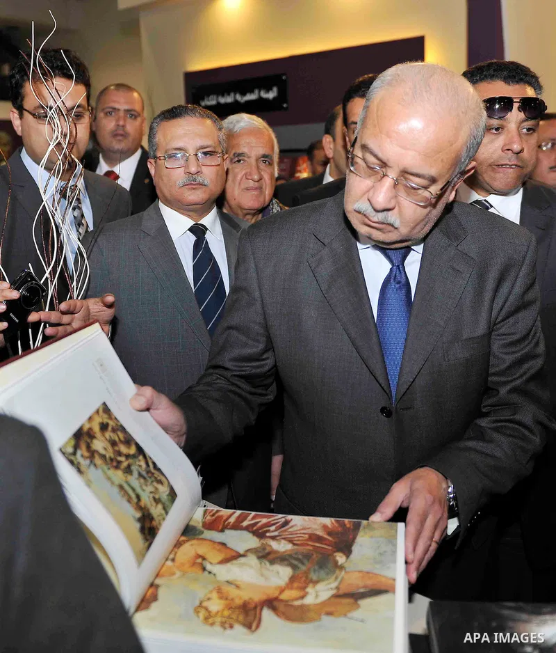 Egyptian Prime Minister Sherif Ismail opens the Cairo International Book Fair, in Cairo, Egypt, on Jan. 27, 2016. Photo by Stranger