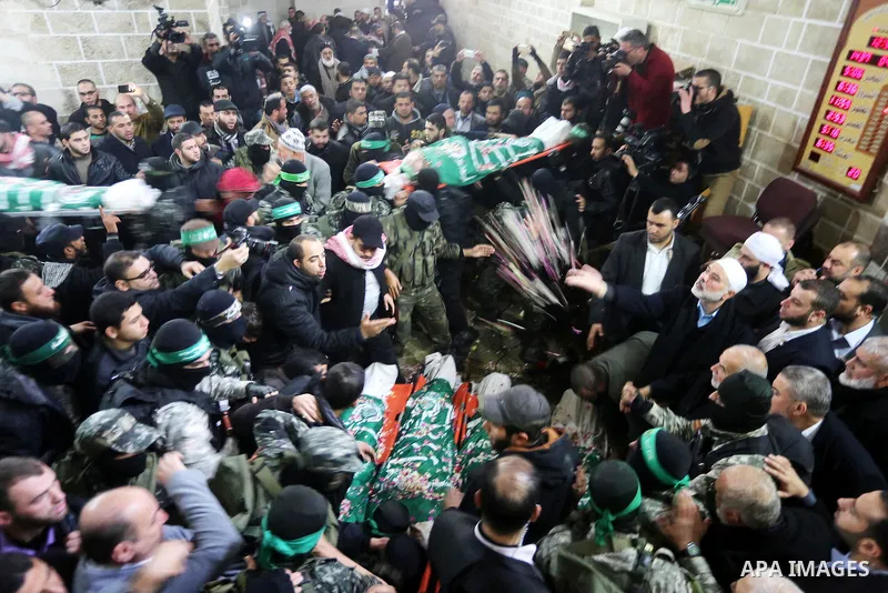 Palestinian members of Ezzedeen al-Qassam, the armed wing of Hamas movement, carry the bodies of the seven Palestinian Hamas militants whom killed after a tunnel, built for fighting Israel, collapsed in the Gaza Strip, d...