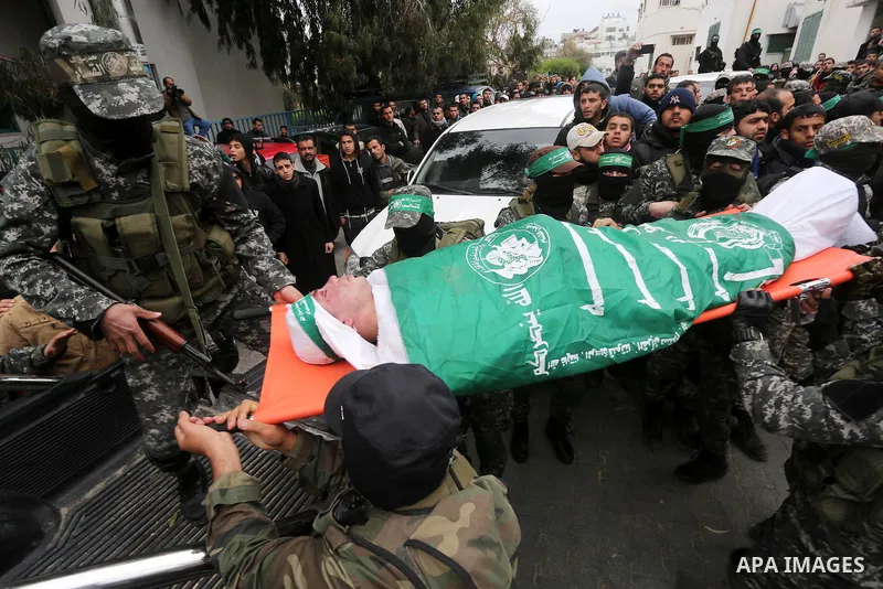 Palestinian members of Ezzedeen al-Qassam, the armed wing of Hamas movement, carry the body of one of the seven Palestinian Hamas militants whom killed after a tunnel, built for fighting Israel, collapsed in the Gaza Str...