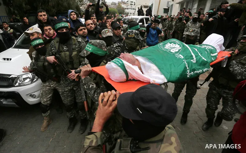 Palestinian members of Ezzedeen al-Qassam, the armed wing of Hamas movement, carry the body of one of the seven Palestinian Hamas militants whom killed after a tunnel, built for fighting Israel, collapsed in the Gaza Str...