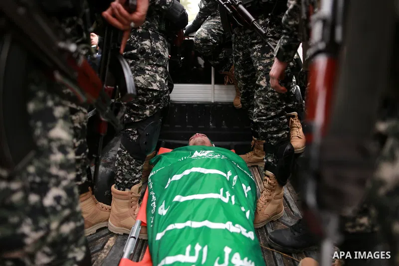 Palestinian Hamas militants transport the body of one of the seven Hamas militants who were killed after a tunnel built for fighting Israel collapsed in the Gaza Strip, during their funeral in Gaza City on January 29, 20...