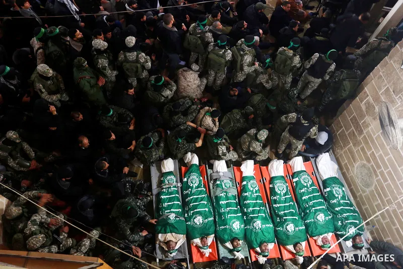 Palestinians pray in front of the bodies of seven Hamas militants who were killed after a tunnel built for fighting Israel collapsed in the Gaza Strip, during their funeral in Gaza City on January 29, 2016. The Ezzedine...