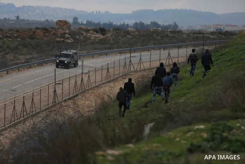 Palestinian protesters clash with Israeli security forces following a demonstration in solidarity with Palestinian prisoners in Israeli jails, outside the compound of the Israeli Ofer Military Prison, near the West Bank...