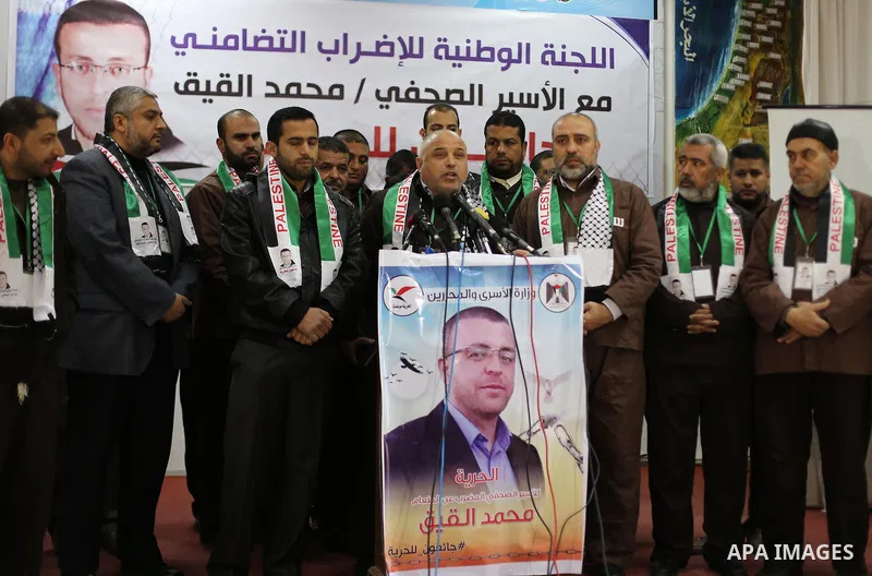 Palestinians on a hunger strike in solidarity with journalist Mohammed al-Qiq who is imprisoned in an Israeli jail at the Ministry of Prisoners, in Gaza City, on January 30, 2016. Qiq is being held under Israel's controv...