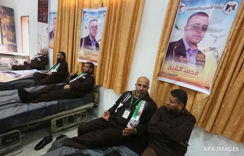 Palestinians on a hunger strike in solidarity with journalist Mohammed al-Qiq who is imprisoned in an Israeli jail at the Ministry of Prisoners, in Gaza City, on January 30, 2016. Qiq is being held under Israel's controv...