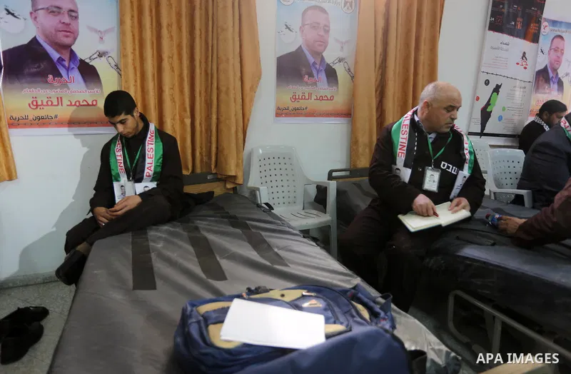 Palestinians on a hunger strike in solidarity with journalist Mohammed al-Qiq who is imprisoned in an Israeli jail at the Ministry of Prisoners, in Gaza City, on January 30, 2016. Qiq is being held under Israel's controv...