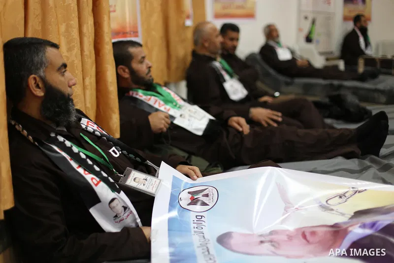 Palestinians on a hunger strike in solidarity with journalist Mohammed al-Qiq who is imprisoned in an Israeli jail at the Ministry of Prisoners, in Gaza City, on January 30, 2016. Qiq is being held under Israel's controv...