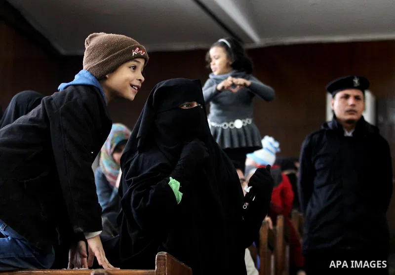 Relatives of Ansar Bait Al-Maqdis group attend their trial in Cairo on January 30, 2016, on charges of assassination of police officers, attempted assassination of interior minister Mohamed Ibrahim and explosions near se...