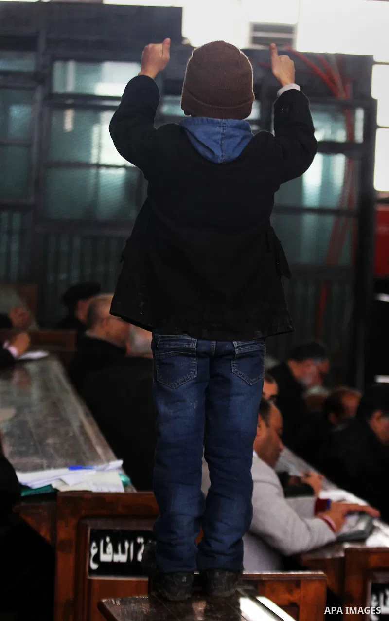 Relatives of Ansar Bait Al-Maqdis group attend their trial in Cairo on January 30, 2016, on charges of assassination of police officers, attempted assassination of interior minister Mohamed Ibrahim and explosions near se...