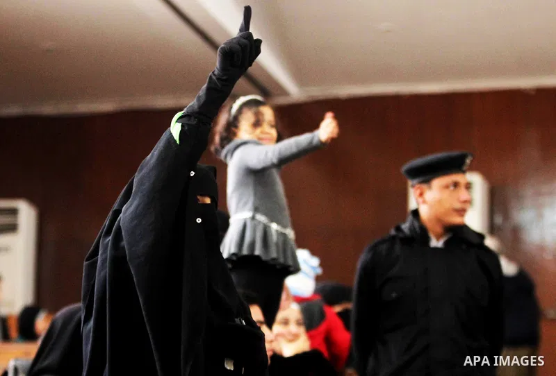 Relatives of Ansar Bait Al-Maqdis group attend their trial in Cairo on January 30, 2016, on charges of assassination of police officers, attempted assassination of interior minister Mohamed Ibrahim and explosions near se...