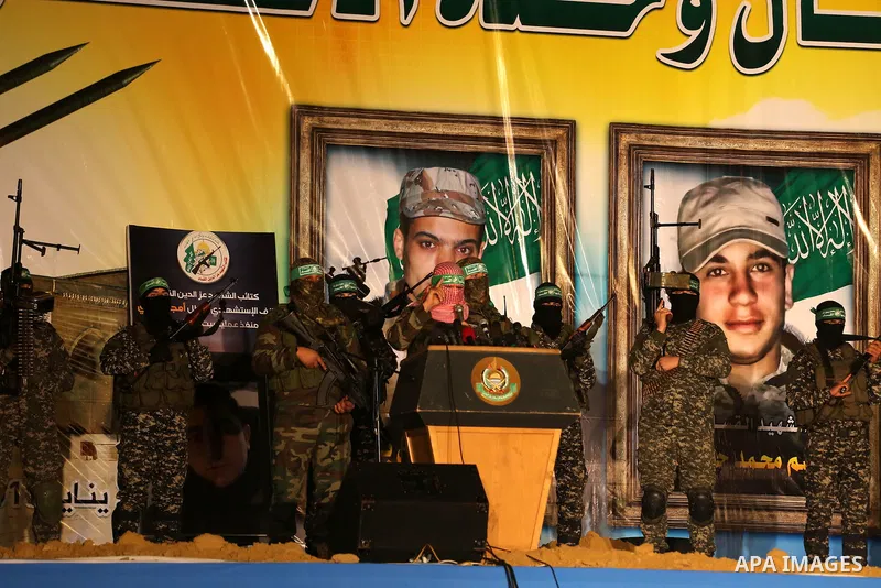 Spokesman of al-Qassam Brigades, the military wing of Hamas movement, Abu Obeida speaks during a gathering to pay tribute to the brigade's militants who died after a tunnel collapsed in the Gaza Strip on January 31, 2016...