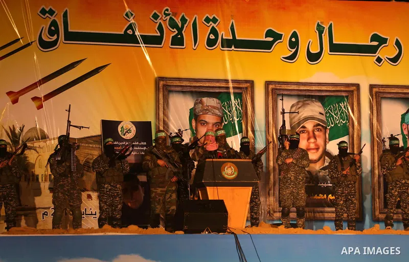 Spokesman of al-Qassam Brigades, the military wing of Hamas movement, Abu Obeida speaks during a gathering to pay tribute to the brigade's militants who died after a tunnel collapsed in the Gaza Strip on January 31, 2016...