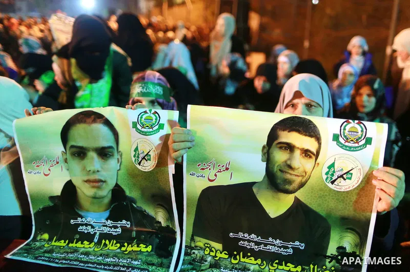 Palestinians supporting Hamas movement take part during a gathering to pay tribute to the brigade's militants who died after a tunnel collapsed in the Gaza Strip on January 31, 2016 in Gaza city. Seven Hamas militants we...