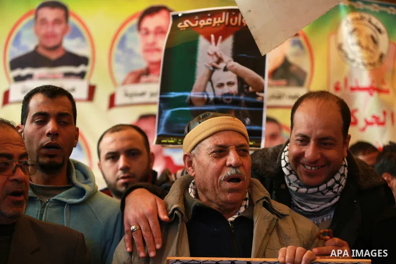Palestinians take part in a protest demanding release the prisoners in Israeli jails, in front of Red cross office, in Gaza city, on Feb. 01, 2016. Photo by Yasser Qudih