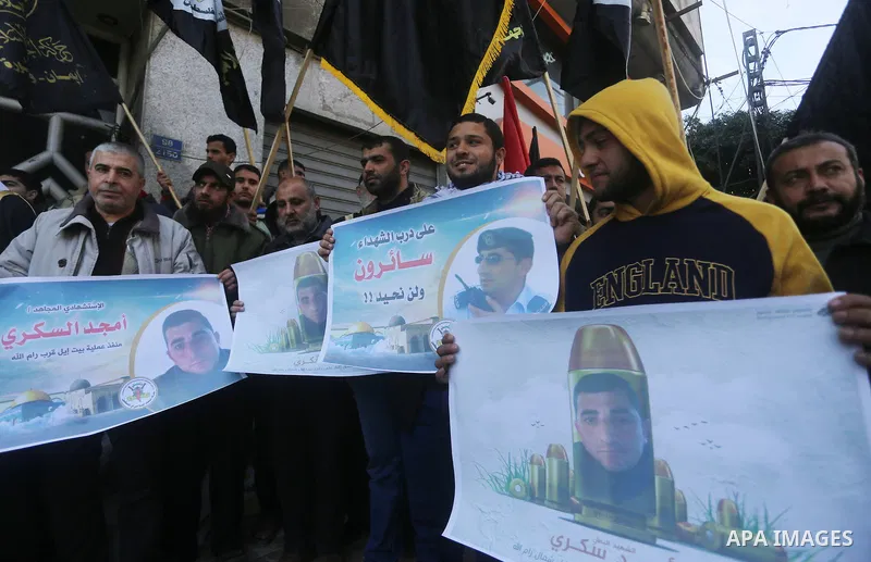 Palestinians take part in a protest to show solidarity with Amjad Sukkari, in Gaza city, on Feb. 01, 2016. A Palestinian opened fire at a checkpoint near the Jewish settlement in the West Bank, wounding three Israelis be...