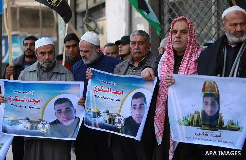 Palestinians take part in a protest to show solidarity with Amjad Sukkari, in Gaza city, on Feb. 01, 2016. A Palestinian opened fire at a checkpoint near the Jewish settlement in the West Bank, wounding three Israelis be...