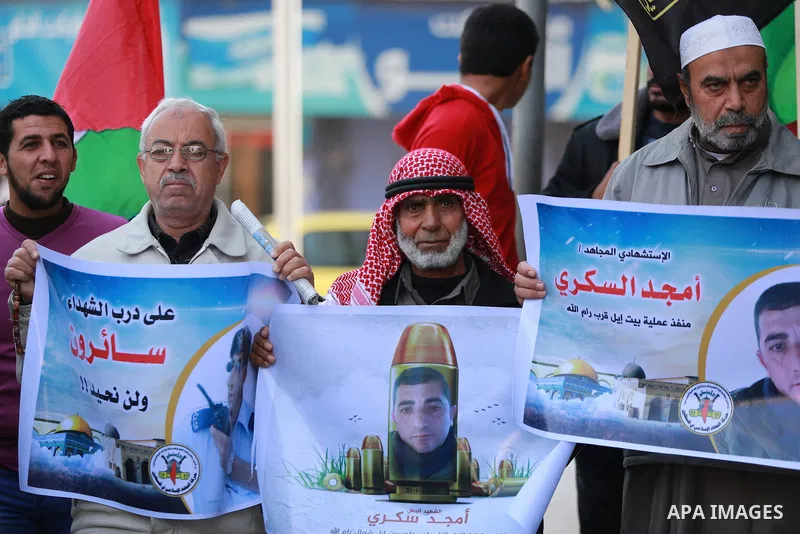 Palestinians take part in a protest to show solidarity with Amjad Sukkari, in Gaza city, on Feb. 01, 2016. A Palestinian opened fire at a checkpoint near the Jewish settlement in the West Bank, wounding three Israelis be...