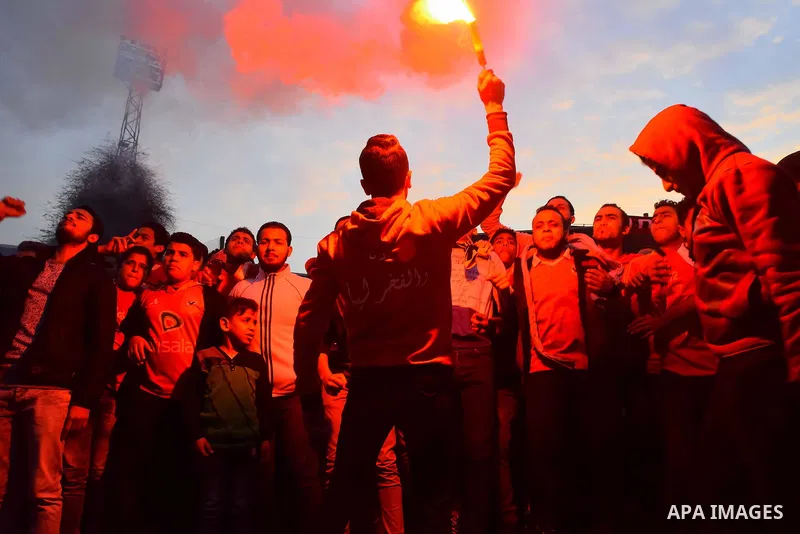 Al Ahly fans, also known as "Ultras", light flares and shout slogans at al-Ahly club's training stadium marking the fourt anniversary of killing al-Ahly fans in what known as the "Port Said massacre", on February 1, 2016...