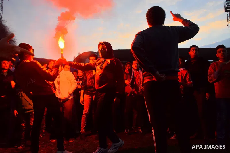 Al Ahly fans, also known as "Ultras", light flares and shout slogans at al-Ahly club's training stadium marking the fourt anniversary of killing al-Ahly fans in what known as the "Port Said massacre", on February 1, 2016...